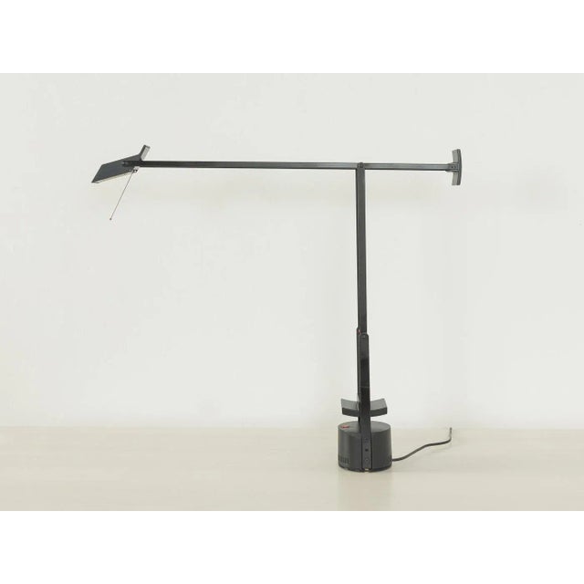 TIZIO table lamp by Artemide. High-quality, adjustable, black stainless steel frame with a rotating lamp head. Quality...