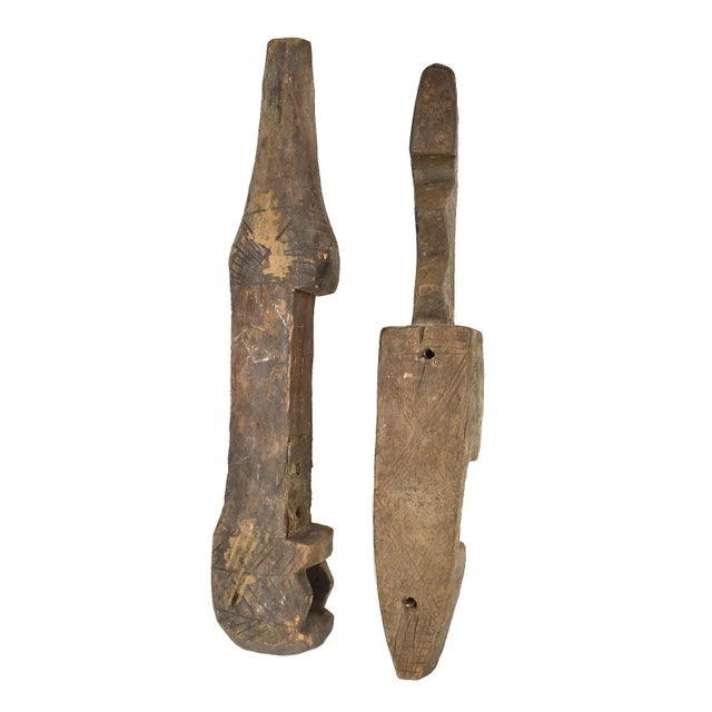 Bamana door locks consist of two components: a stationary vertical element, often adorned with abstract or figurative...