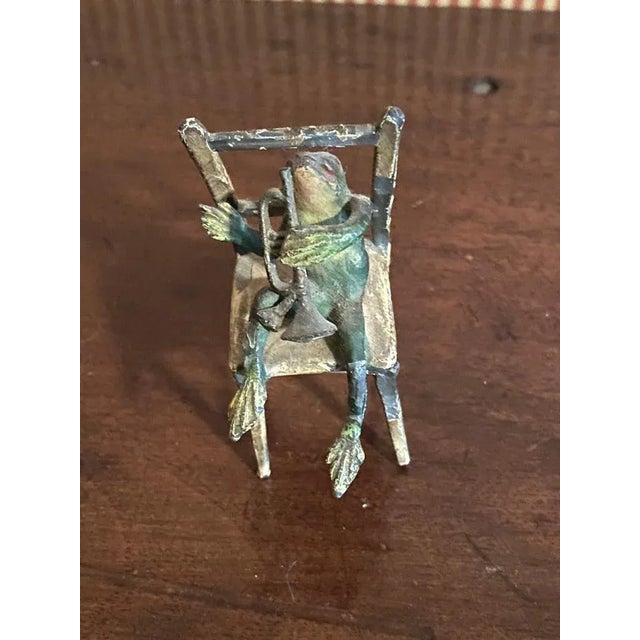 A handcrafted group of Frog Musicians, sitting on a bench and two chairs. There is some loss to paint. Otherwise they are...