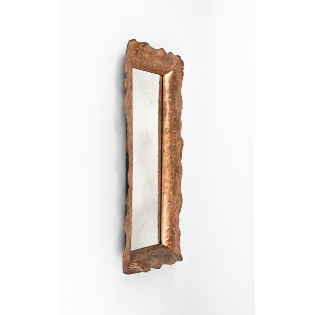 Midcentury amazing wall mirror in hammered copper frame by Angelo Bragalini. Made in Italy in the 1960s. This piece is...