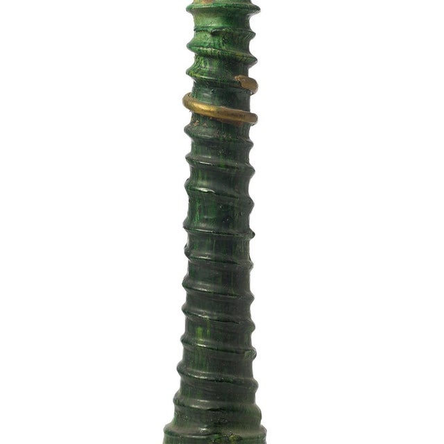 Characterized by a ridged elongated silhouette and a deep green Tamegroute glaze, this handmade ceramic candlestick is...
