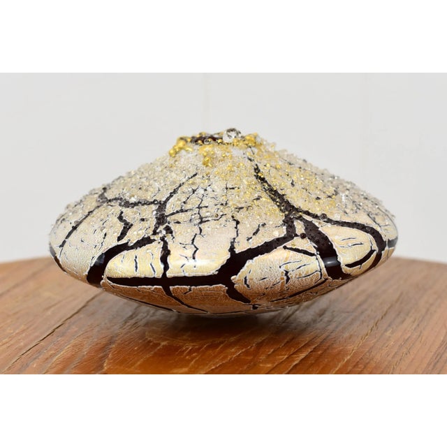 Fantastic closed form vessel by Marsha Blaker - DeSomma. Measurements: Height: 3" Width: 5.5" Width (of hole at top): 1"...