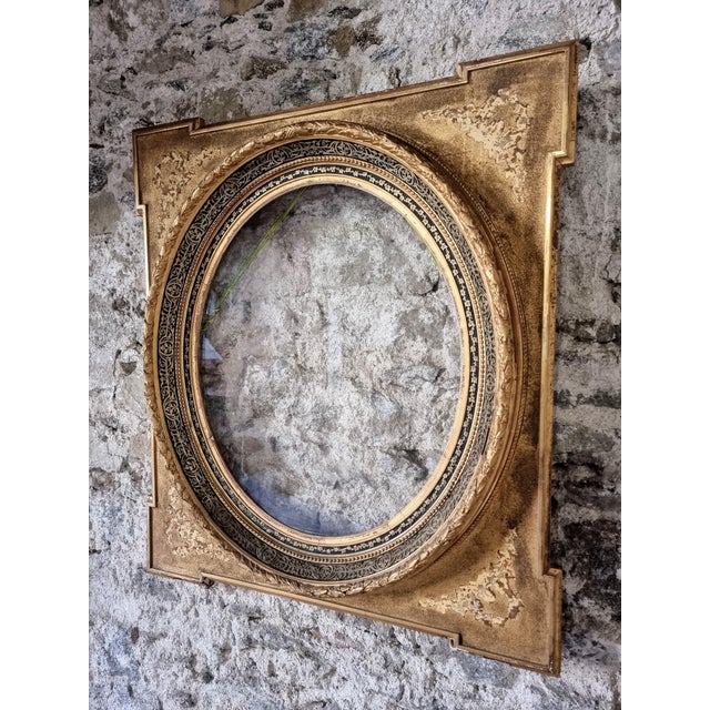 This antique napoleon iii wall decoration with glass panel and gilded frame originates from france and dates to the late...