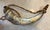 Handmade powder horn crafted from natural horn with a detailed scrimshaw-style deer hunting scene. This piece features a...