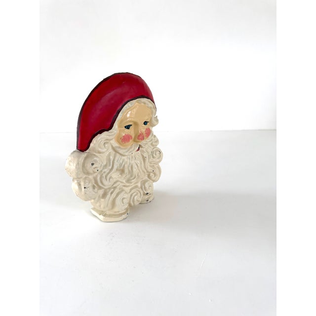 Jolly mid century Santa Claus cast iron doorstop. Festive and unique Christmas decor for your home. Enameled finish and...