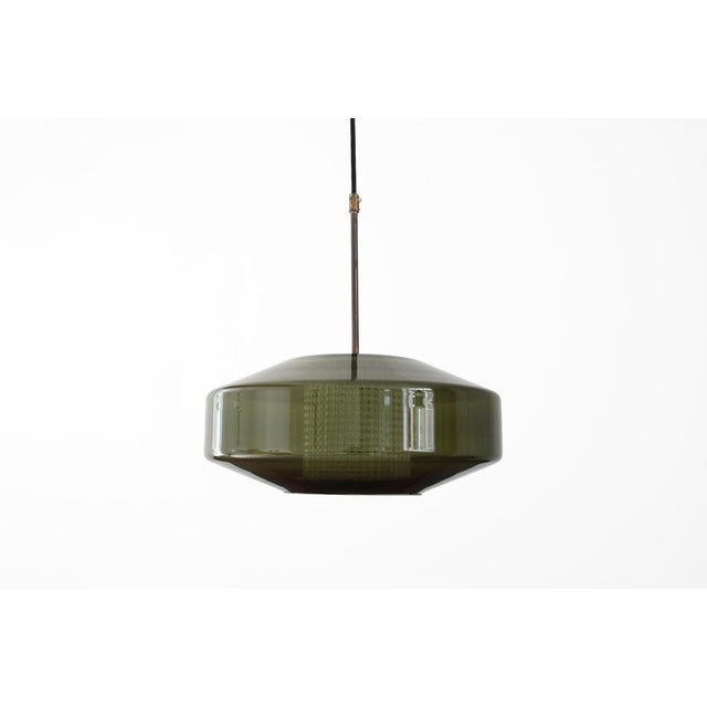 Exceptional pendant lamp designed by Carl Fagerlund for Orrefors in Sweden. Fagerlund is known for his refined designs in...