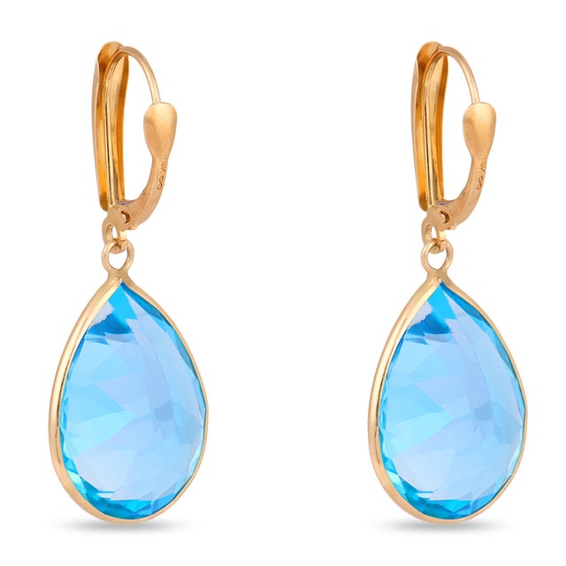 A vibrant pair of vintage drop earrings showcasing two beautifully cut pear shape blue topaz totaling approximately 25.20...