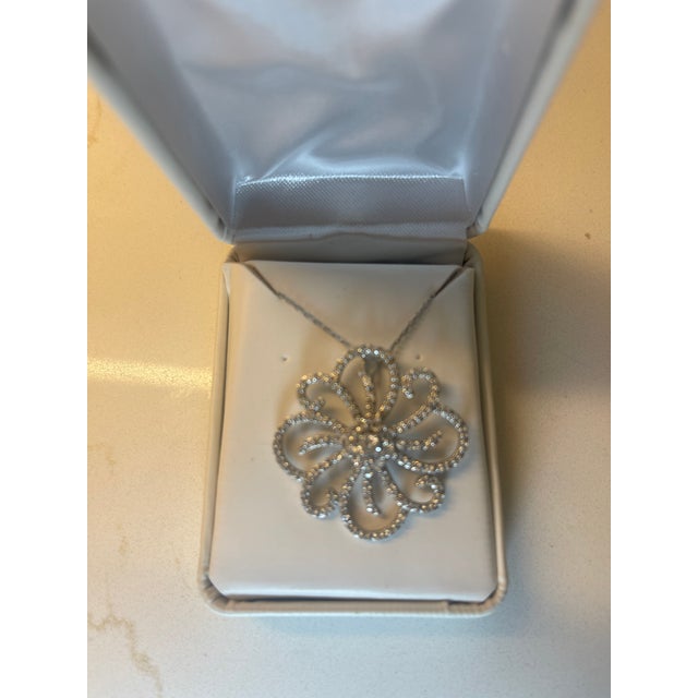 3" round flower burst pendant done in top quantity CZs and sterling