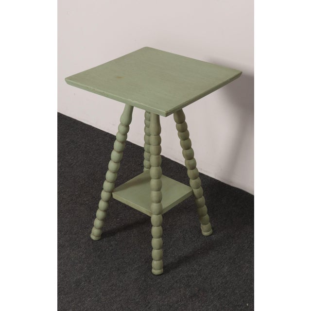 Vintage mint green bobbin side table (ca. 1940s, USA). Spool/bobbin ornamentation present along the legs with two...