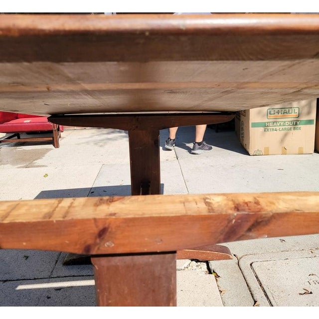 Early 20thc pine trestle table from Pennsylvania with red painted base.The top has a wonderful aged patina.The table is in...