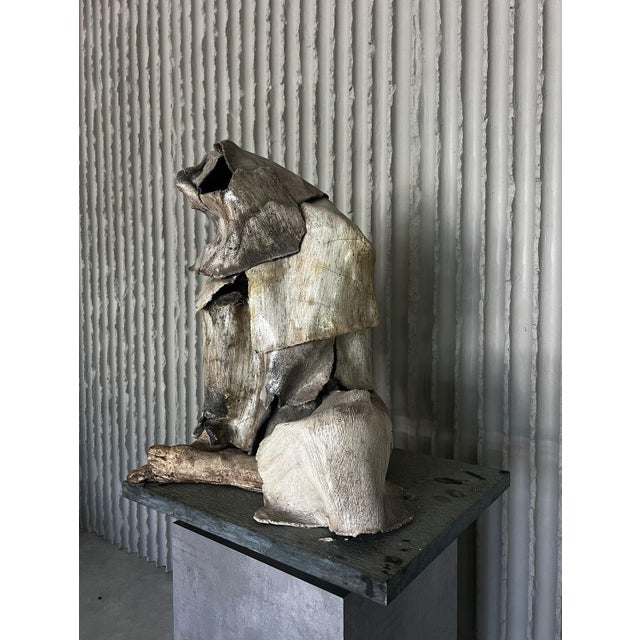 Artist unknown but signed belgium 1970s h 70cm w 58cm d 47cm a striking monumental ceramic sculpture depicting a seated,...