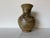 Striking vintage studio pottery vase featuring an organic, hand-thrown form with a softly rounded body and flared neck....