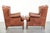 Set of two beautiful English-style cowhide wing armchairs with matching piping and a characterful appearance. : This set...