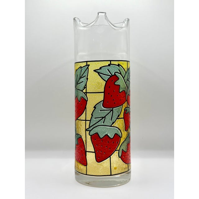 A charming vintage strawberry glass pitcher, attributed to West Virginia Glass Specialty Company, likely dating to the...