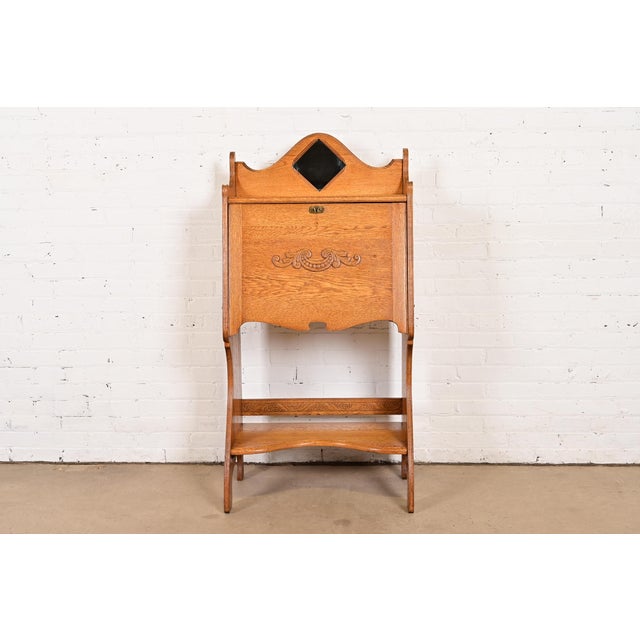 An exceptional Mission, Arts & Crafts, or Late Victorian drop front secretary desk In the manner of Stickley Brothers USA,...