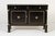 A pair of 18th century italian ebonised cabinets. rectangular in shape, the commodes have architectural column trusses...