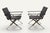 An elegant pair of folding armchairs from the 1970s, likely of Italian manufacture, combining a polished chrome metal...