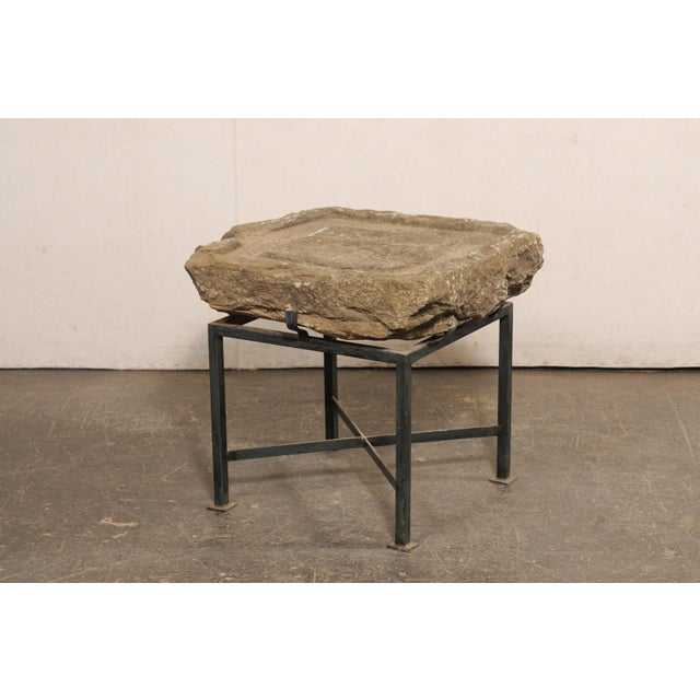 A Spanish hand-carved 19th century stone trough top, custom side table. This unique accent table has been custom fashioned...
