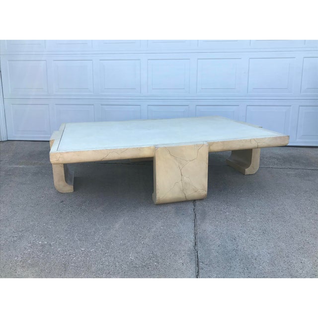 Monumental Asian inspired ming leg coffee table in creamy tan hand lacquered faux goatskin with a lizard-textured center...