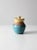 This is a vintage studio pottery jar. The hand-crafted jar features a lovely turquoise blue and yellow glaze. Base signed...