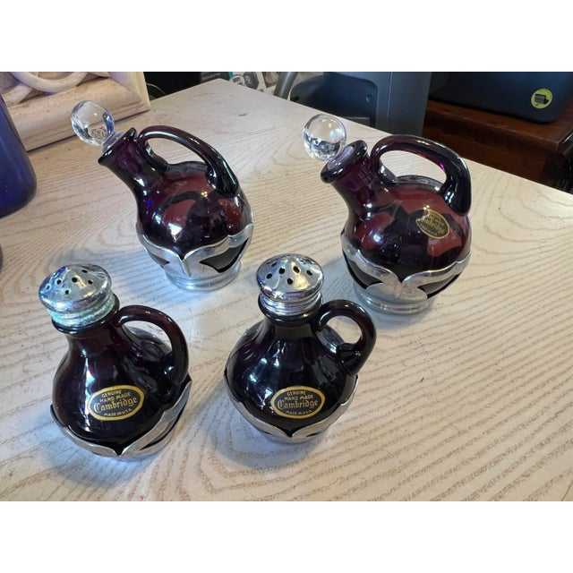 Absolutely Amazing Cambridge 5 Piece Condiment Set. The set features Cambridge Handled Cruets with Clear Glass Stoppers,...