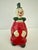 Vintage porcelain clown bell. Red with black polka dots. Approximately 2” x 2” x 5”.