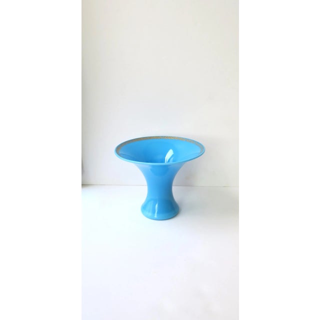 A beautiful Italian azure blue opaline glass vase with gold detail around lip, circa mid-20th century, 1960s, Italy....