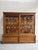 This 1950s display case has been completely restored. It features a glass-fronted upper section on the front and sides....