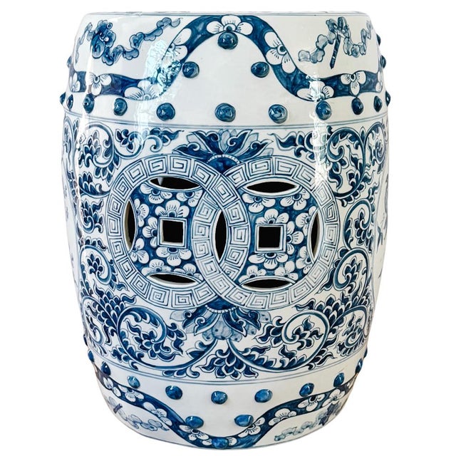 A classic Chinese export blue-and-white porcelain garden stool crafted in a traditional drum silhouette and decorated with...
