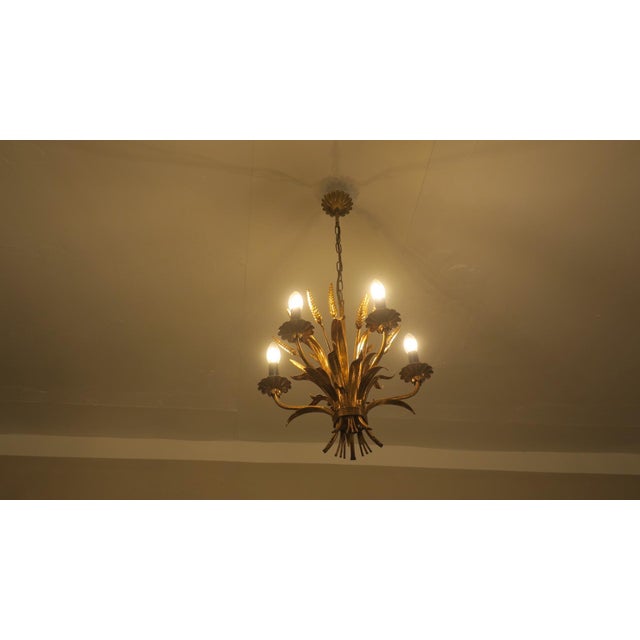 Hans Kögl 1960-70 chandelier with patinated gold plated metal leaves and wheatsheaves. I have official proof of...