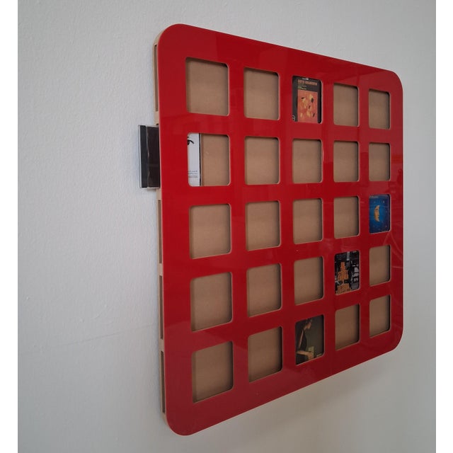 Wall-mounted CD rack that can hold 25 CDs or photos. The images of music album covers create an interesting graphic and...