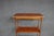 Mahogany etagere by Baker Furniture featuring an open four-shelf design, turned supports, and a molded base with a single...