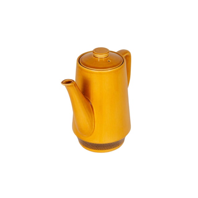 A Japanese mid-century coffee pot in mustard yellow, made by Aurora Ironstone. Sleek lines throughout, with a straight...