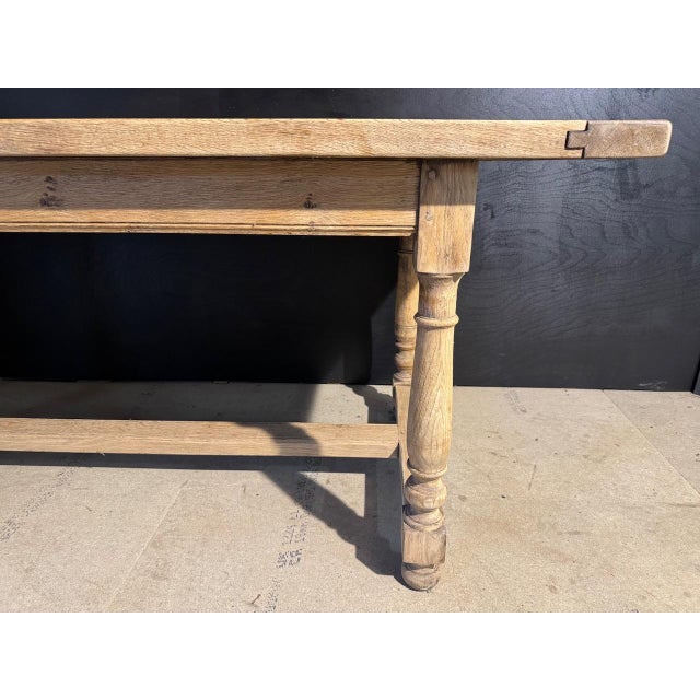 A solid Oak Farmhouse Dining Table dating to the 1920s. Of solid pegged construction this table is of good quality. We...