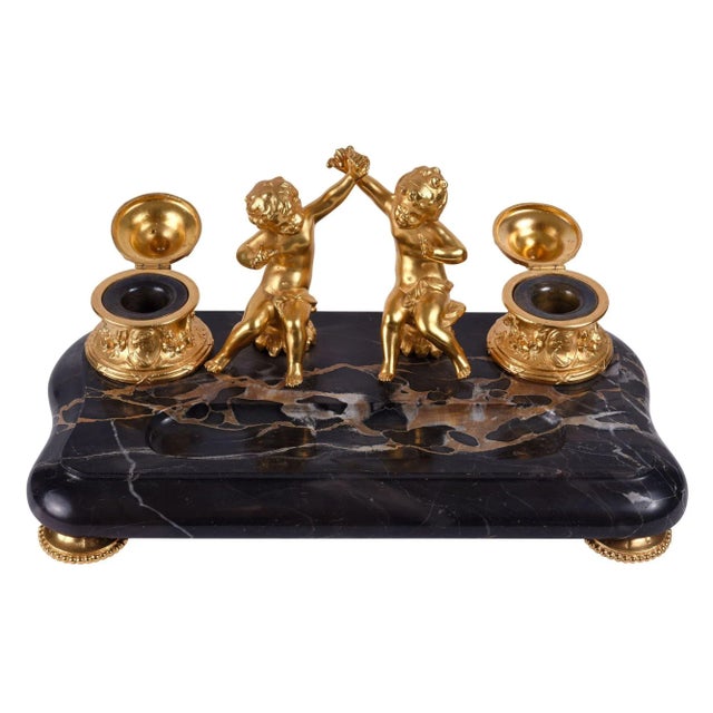 Antique French dore bronze cherub marble inkwell, circa 19th century. This antique french inkwell is crafted in marble and...