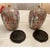 Offered is a vintage pair of large ginger jars. This set features a beautiful array of colors set on a wooden pedestal....