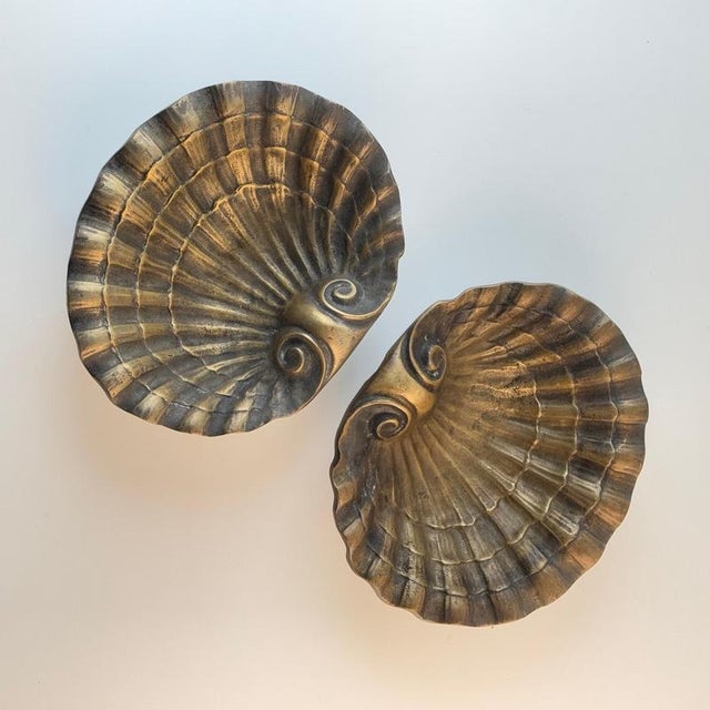 A striking pair of Austrian Secessionist vide-poche bowls, finely cast in solid brass and entirely hand-worked, dating to...