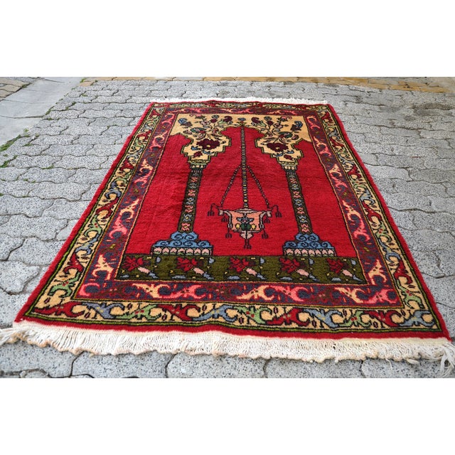 This is a vintage Turkish Anatolian kilim rug from the 1960s. The piece was hand-woven.