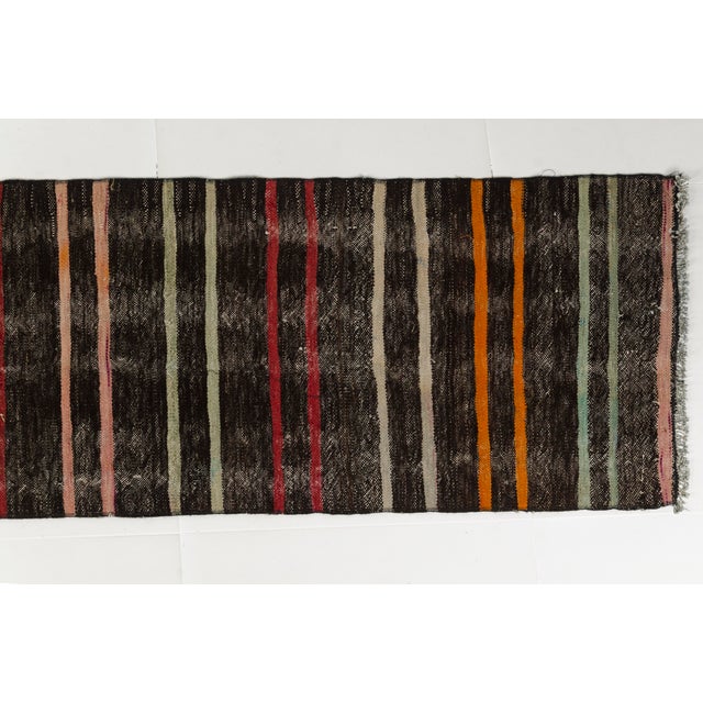 This is a vintage Turkish Oushak rug from the Mid 20th Century. The piece was hand-knotted.