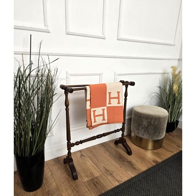 Beautiful vintage Italian wood towel rack or quilt stand with squared carved junctions and wide feet. This towel rack or...