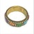 This elegant Art Deco-style bangle is a refined testament to the movement’s love of geometry, color, and metallic...