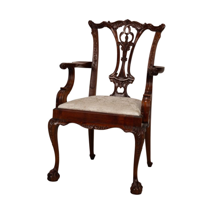 Description Beautiful pair of antique Chippendale Revival armchairs dating to the late 19th century, circa 1880 to 1900....