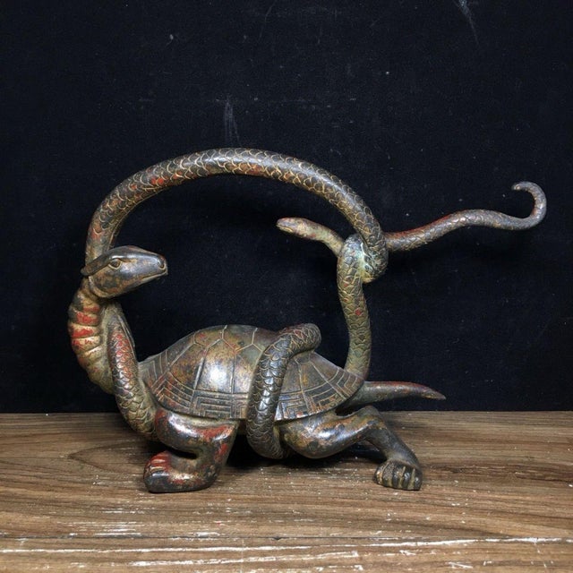 This striking antique bronze sculpture depicts the Dark Warrior, a revered mythical creature composed of a turtle entwined...