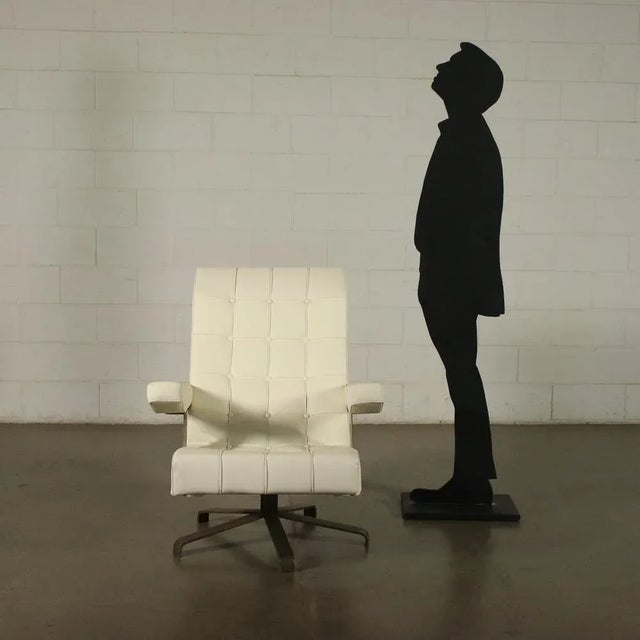 Swivel armchair, metal base, foam padding, leatherette upholstery.