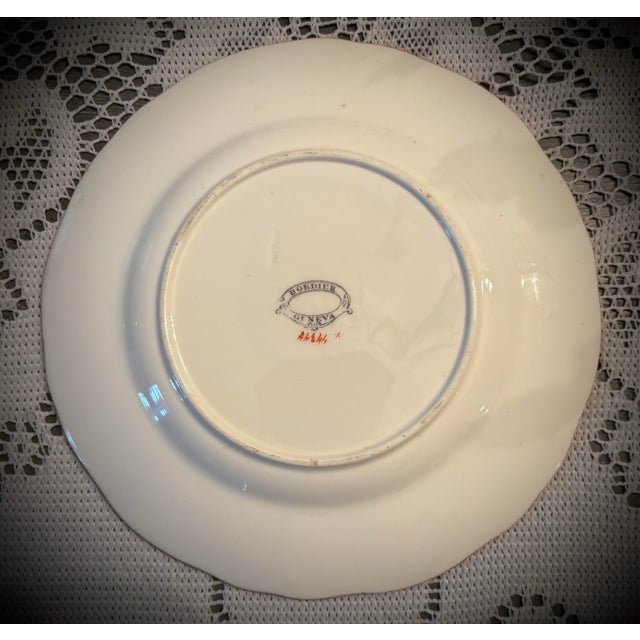 Minton was a prominent English pottery manufacturer founded in Stoke-on-Trent in 1793. Renowned for its high-quality...