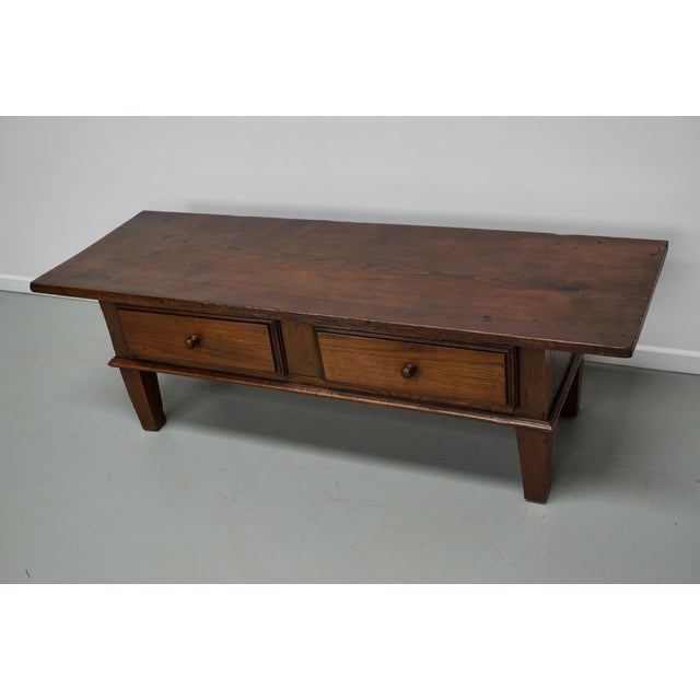 This coffee table was converted from an old 19th century chestnut farmhouse prepping table. It retained a very nice patina...