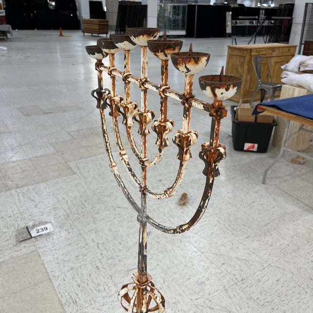 This candle holder/menorah was purchased in France. It was made in the 18th century and has neoclassical characteristics....