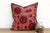 This 16-inch square pillow is a breathtaking fragment of Rajasthani heritage, repurposed from antique Banjara textiles...