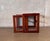 A sleek pair of vintage Mid-Century Modern nesting tables crafted in richly grained teak. Featuring clean, architectural...