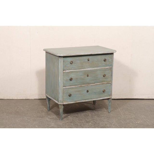 A Swedish smaller-sized, Gustavian style, painted chest of drawers from the 20th century. This vintage chest from Sweden,...